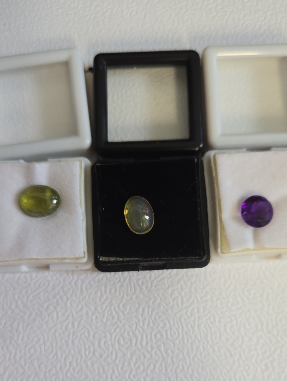 Three Faceted Gemstones  Green Apatite , Translucent Fire Opal, Purple Amethyst.